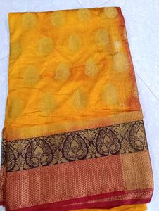 Vibrant Yellow Saree with Brocade Blouse