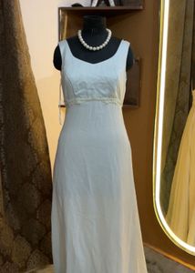 Elegant White Gown with Pearl Necklace