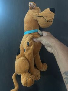brown Scooby-Doo plush toy wearing a blue collar