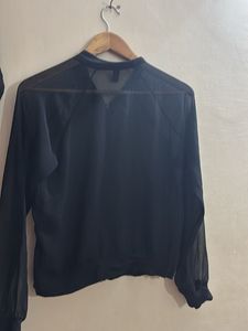 transparent black shrug top with zip
