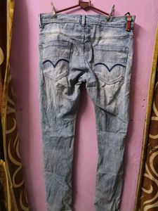 Distressed Light Wash Denim Jeans