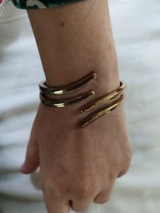 Unique Gold Tone C-Shaped Bracelet
