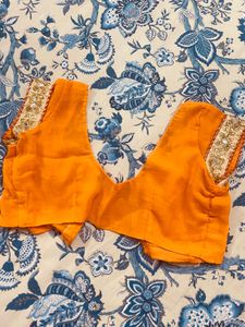 Exquisite Orange Saree with Embellishments