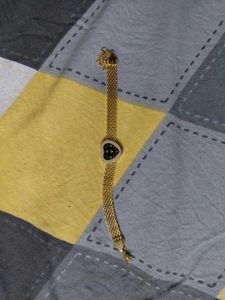 Elegant Gold Chain Watch with Charm Bracelet