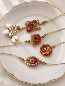 Handmade Rakhi Set with Shells & Pearls