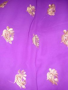 Vibrant Purple Saree with Gold Embellishments