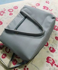 Stylish Grey Tote Bag with Pom-Pom Accent