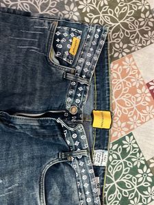 Distressed Blue Denim Jeans