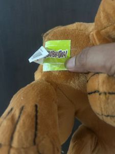 brown Scooby-Doo plush toy wearing a blue collar