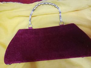 Dark maroon Fancy Clutch...