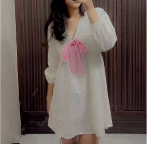 White Textured Dress with Pink Bow