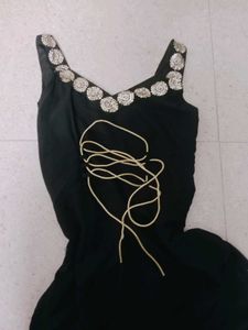 Elegant Black Saree with Gold Embellishments