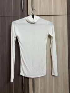 OZBRIDGE SHEER TURTLE NECK TOP