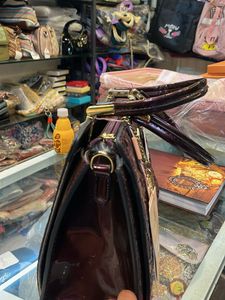 Elegant Embossed Purple Handbag