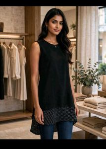 Chic Black Sleeveless Top with Polka Dot Hem