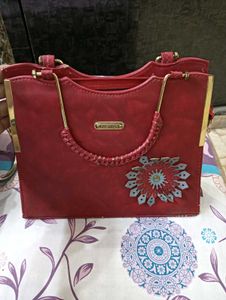 Stylish Teal Handbag with Gold Accents