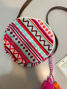 Astrid round Geometric print sling bag for women