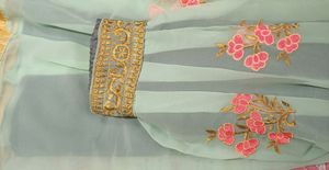 light blue colour fully stitched skirt with golden border in bottom and and work in flair .