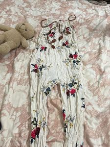 off white jumpsuit with floral touch