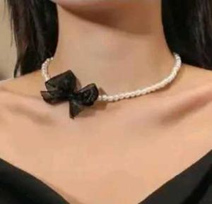 Chic Pearl Necklace with Black Bow