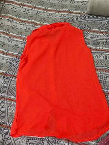 Vibrant Red Sleeveless Button-Up Top