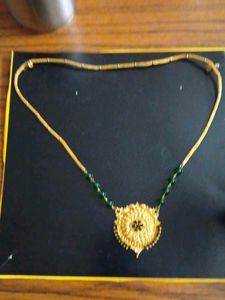Elegant Gold Necklace with Green Beads