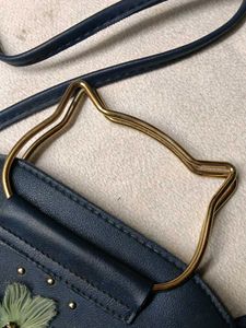 Chic Navy Blue Bag with Flower Detail