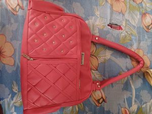 Quilted Pink Handbag with Embellishments
