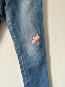 Women's Blue Distressed Jeans with Patch