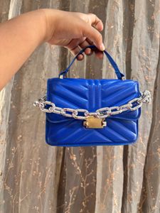 Blue sling purse
