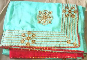 Stunning Teal Saree with Gold Embellishments