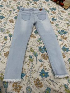Light Wash Denim Jeans with Frayed Hem