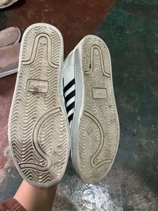 White Sneakers with Black Stripes