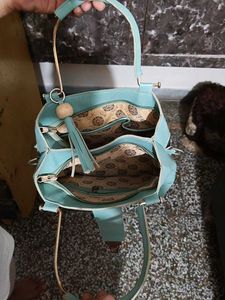Chic Teal Handbag with Gold Accents