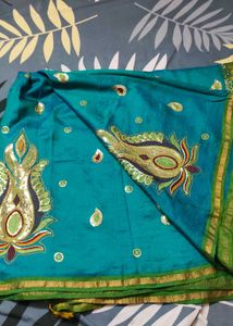 Elegant Teal Saree with Embellished Detailing