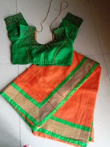 Vibrant Orange Saree with Embellished Blouse
