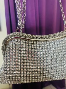 Studs embellished party clutch