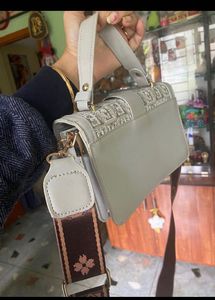 Free Delivery: Stylish Grey Handbag with Monogram