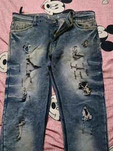 Distressed Blue Denim Jeans