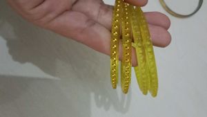 Elegant Yellow Bangles with Golden Embellishments