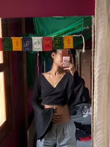 black crop to with long flared sleeves