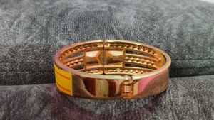 Elegant Rose Gold Bangle with Black Stones