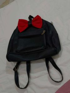 Black Backpack with Red Bow