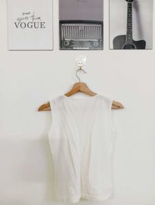 Chic White Sleeveless Top with Floral Embroidery
