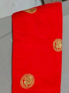 Elegant orange Saree with Gold Embellishments