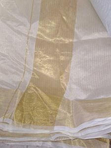 Elegant White and Gold Saree Onam