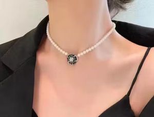 Elegant Pearl Necklace with Flower Pendant