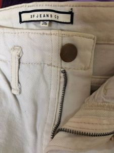 Cream straight leg jeans