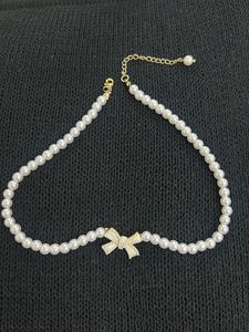 Elegant Pearl Choker Necklace with Bow