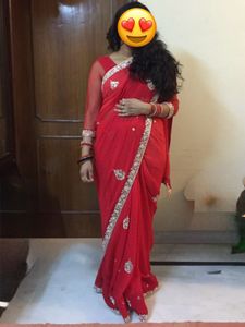 Vibrant Red Saree with Intricate Embellishments